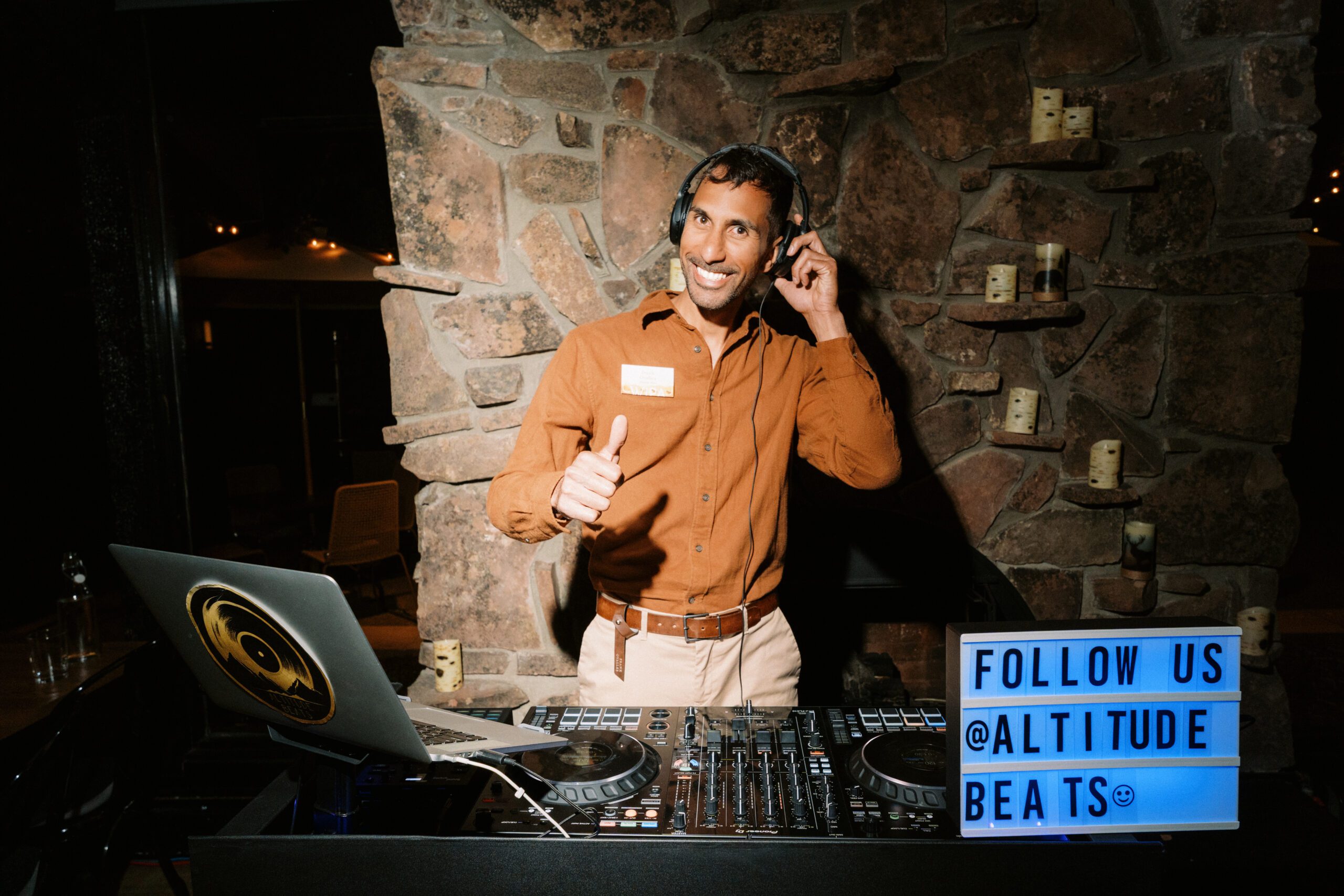 Elegant wedding DJ booth with lighting at a Colorado wedding venue